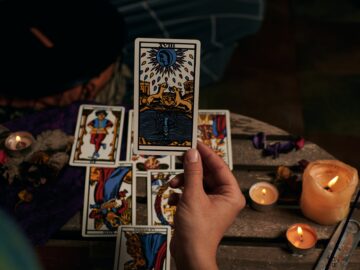 Close-up of a fortune teller reading tarot cards