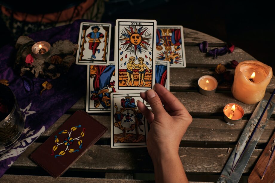 Close-up of a fortune teller reading tarot cards