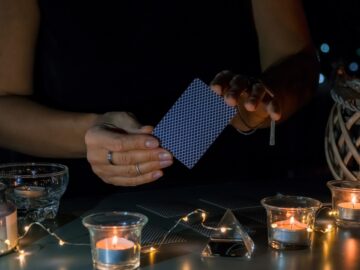 Tarot cards, Fortune telling on tarot cards at night by candlelight, magic crystal, occultism,