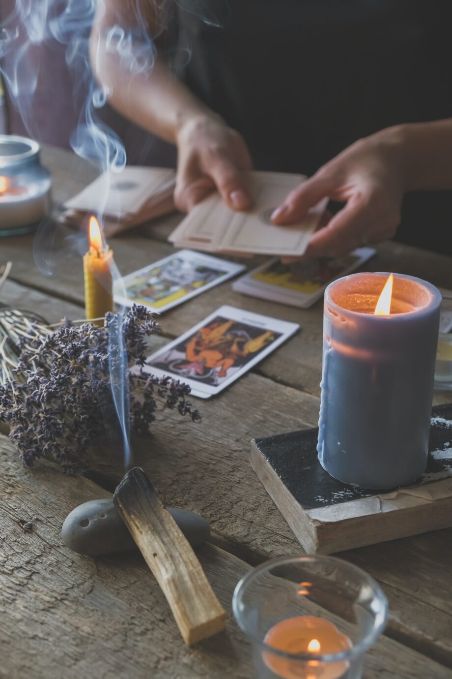 Tarot cards, Fortune telling on tarot cards at night by candlelight, magic crystal, occultism