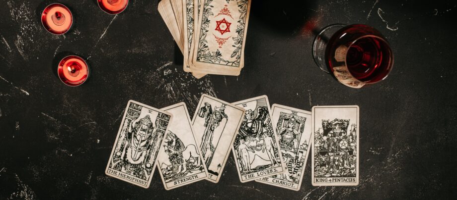 Tarot cards on red background, occult and magic